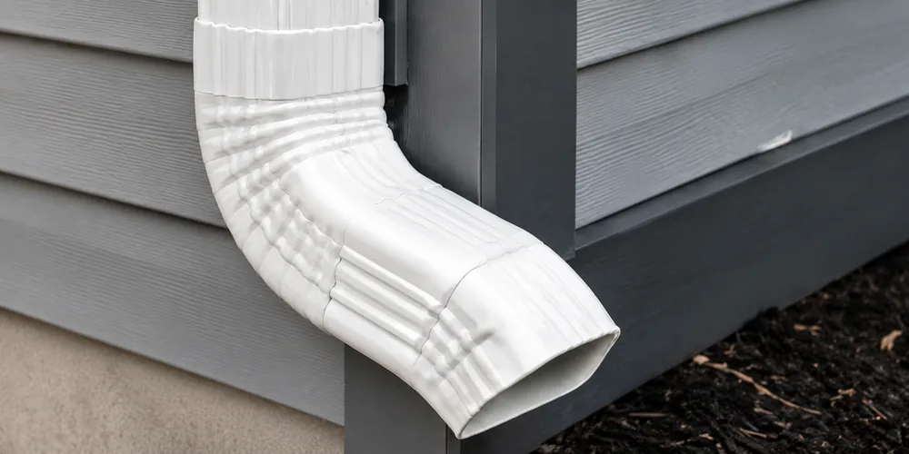 Gutter miter and downspout connector detail